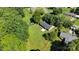 Overhead view of a cozy home nestled amongst trees, boasting a large lawn and serene surroundings at 113 Lou Dr, Gastonia, NC 28052