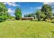 Expansive backyard with lush green grass, mature trees, and room to build your dream oasis at 113 Lou Dr, Gastonia, NC 28052