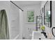 Clean bathroom with a shower-tub combo, window, and modern vanity at 113 Lou Dr, Gastonia, NC 28052