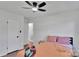 Bedroom featuring hardwood floors, ceiling fan, a bed, and a partially open door at 113 Lou Dr, Gastonia, NC 28052