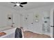 Bedroom with hardwood floors, and decorated with gold geometric mirrors on the wall at 113 Lou Dr, Gastonia, NC 28052