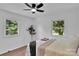 Bedroom with hardwood floors, a ceiling fan, and dual view windows at 113 Lou Dr, Gastonia, NC 28052