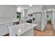Updated kitchen features white cabinets, stainless steel appliances, and quartz countertops at 113 Lou Dr, Gastonia, NC 28052