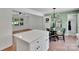 A modern kitchen island is adjacent to an open dining area at 113 Lou Dr, Gastonia, NC 28052