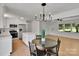 Bright open layout featuring a sleek black chandelier above the dining table at 113 Lou Dr, Gastonia, NC 28052