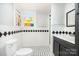 Bathroom with black and white tile and a stained-glass window at 1145 Earl Rd, Shelby, NC 28152