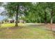 This home exterior shows a large lot, driveway, and separate garage at 1145 Earl Rd, Shelby, NC 28152