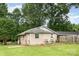 Quaint home exterior shows an expansive yard and mature tree coverage at 1145 Earl Rd, Shelby, NC 28152