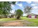 This home exterior shows a large lot, driveway, and separate garage at 1145 Earl Rd, Shelby, NC 28152