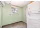 Bright view of the kitchen including a washer/dryer combo and a window letting in natural light at 1145 Earl Rd, Shelby, NC 28152