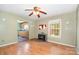 View of living room featuring hardwood floors, fireplace, and view into the kitchen at 1145 Earl Rd, Shelby, NC 28152