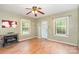 Spacious living room featuring hardwood floors, fireplace, and a front door at 1145 Earl Rd, Shelby, NC 28152
