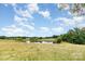 A serene and scenic view of the pond and the surrounding landscape at 1145 Earl Rd, Shelby, NC 28152