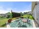 Backyard patio area with outdoor furniture, a privacy screen, and a green rug at 125 White Apple Way, Statesville, NC 28625