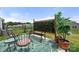 Backyard patio area with outdoor furniture, privacy screen, and pots at 125 White Apple Way, Statesville, NC 28625