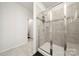 Modern bathroom featuring a glass shower with tiled walls and a neutral color palette at 125 White Apple Way, Statesville, NC 28625