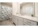 Bathroom featuring a white vanity, toilet, and shower with curtain at 125 White Apple Way, Statesville, NC 28625