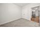 A bedroom featuring carpeted floors, a double door closet, and neutral walls at 125 White Apple Way, Statesville, NC 28625