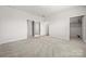 The bedroom has neutral carpet with a walk-in closet, and multiple doors at 125 White Apple Way, Statesville, NC 28625