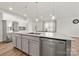 Open kitchen featuring an island, stainless steel appliances, and wood flooring at 125 White Apple Way, Statesville, NC 28625