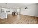 Bright, open-concept living room with modern lighting and direct access to the modern kitchen at 125 White Apple Way, Statesville, NC 28625