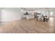 Spacious open-concept living area with wood floors connecting the kitchen and dining area at 125 White Apple Way, Statesville, NC 28625