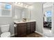 Bathroom showcasing double sink vanity, wood-look flooring, and plenty of light at 12522 Palomino Dr, Midland, NC 28107