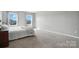 Comfortable bedroom featuring carpet flooring, light gray walls and lots of natural light at 12522 Palomino Dr, Midland, NC 28107