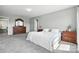 Spacious bedroom with gray walls, carpet flooring, and dark wood furniture at 12522 Palomino Dr, Midland, NC 28107