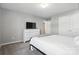 Bedroom features neutral walls, carpet, and modern furniture at 12522 Palomino Dr, Midland, NC 28107