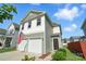 Charming two-story home with a two-car garage and an American flag waving in front at 12522 Palomino Dr, Midland, NC 28107