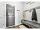 Well-organized mudroom with custom built-ins for coats, hats, and shoes upon entering the home at 12522 Palomino Dr, Midland, NC 28107