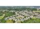 An aerial view of the neighborhood with lush trees surrounding the charming houses at 12525 Druids Glen Dr, Pineville, NC 28134