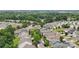 Community aerial view showcasing the lush green canopy and diverse housing styles in the neighborhood at 12525 Druids Glen Dr, Pineville, NC 28134