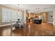 Eat-in kitchen with stainless steel appliances, a central island, and a bright breakfast nook at 12525 Druids Glen Dr, Pineville, NC 28134