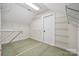 Walk-in storage area with built-in shelving and carpet flooring providing organized storage, and room for customization at 12525 Druids Glen Dr, Pineville, NC 28134