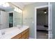 Bathroom with a double sink vanity and views into the bedroom at 1587 Summit View Dr, Rock Hill, SC 29732