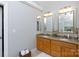 Bright bathroom featuring a granite countertop, double sinks, and decorative mirrors at 1587 Summit View Dr, Rock Hill, SC 29732