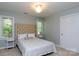 Well-lit bedroom features a tufted headboard and natural light at 1587 Summit View Dr, Rock Hill, SC 29732