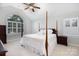 Serene main bedroom suite with a four-poster bed, neutral tones and multiple windows at 1587 Summit View Dr, Rock Hill, SC 29732
