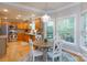 Sunlit dining area with chandelier that connects to a kitchen with stainless steel appliances at 1587 Summit View Dr, Rock Hill, SC 29732