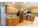 Well-lit kitchen with stainless steel appliances, wood cabinets, and hardwood floors at 1587 Summit View Dr, Rock Hill, SC 29732