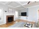Bright living room with a brick fireplace, white mantle, and built-in shelving at 1587 Summit View Dr, Rock Hill, SC 29732