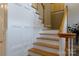 Elegant wooden staircase with white risers and natural wood treads at 1587 Summit View Dr, Rock Hill, SC 29732