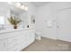 Bathroom with double vanity, framed mirror, and wood look flooring at 170 Aspire Cir # 31, Wingate, NC 28174