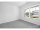 Empty bedroom with two windows offering natural light and views of the neighborhood at 170 Aspire Cir # 31, Wingate, NC 28174