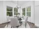 Bright dining area with a round table, stylish chairs, and natural light at 170 Aspire Cir # 31, Wingate, NC 28174