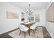 A dining room featuring hardwood floors, a rustic wood table, and lots of natural light at 170 Aspire Cir # 31, Wingate, NC 28174