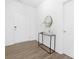 Clean entryway featuring a modern console table, minimalist decor, and wood-look flooring at 170 Aspire Cir # 31, Wingate, NC 28174