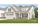Charming home featuring a two-car garage and a cozy front porch at 170 Aspire Cir # 31, Wingate, NC 28174